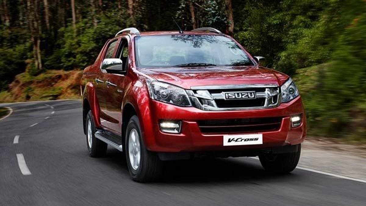 Isuzu D-Max pickup red color on road nature background