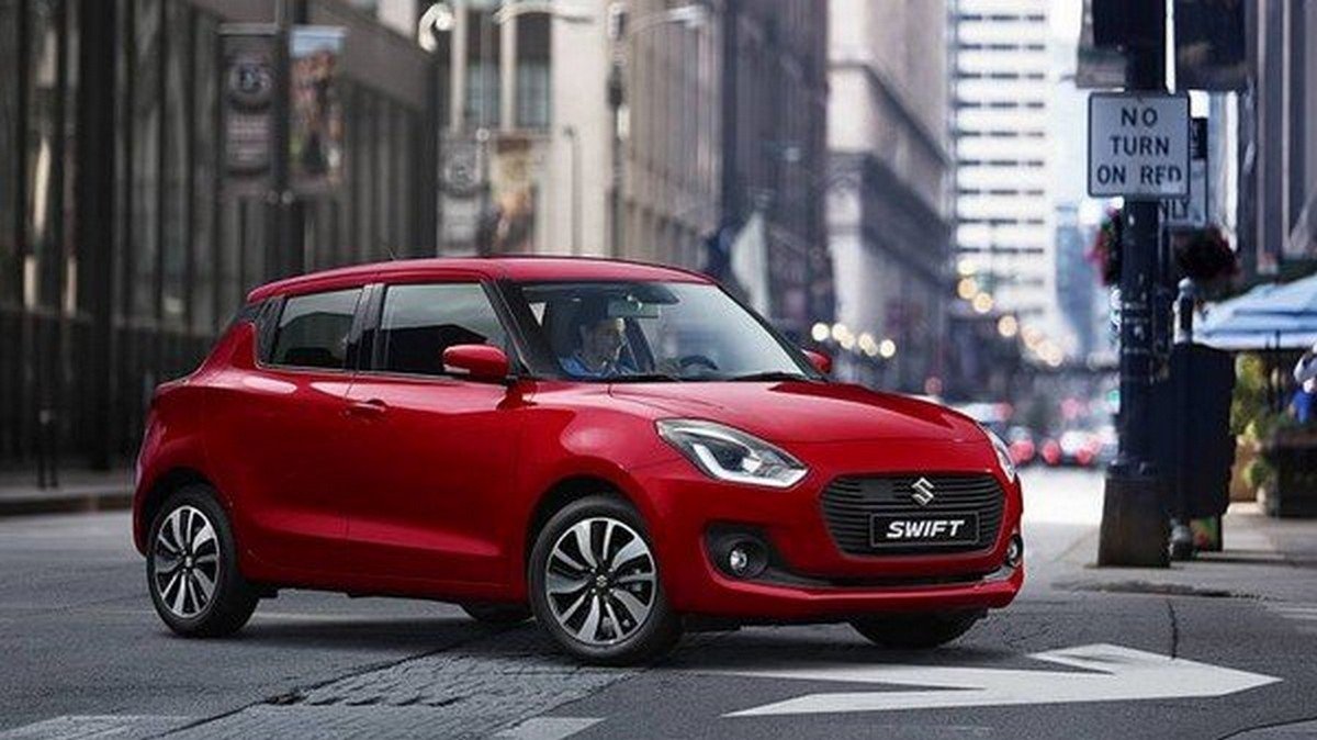 best cars for beginners in India Maruti Suzuki Swift front face street background