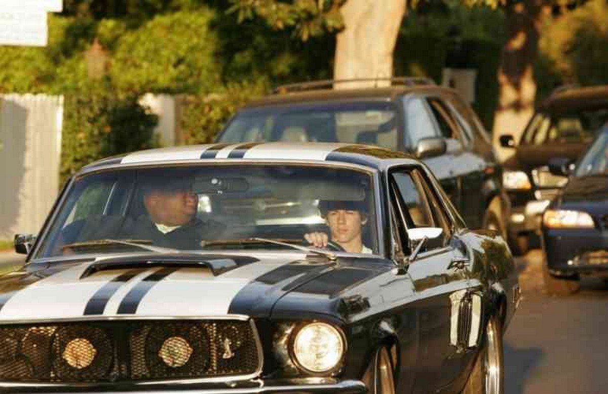 Nick Jonas driving his 1968 Ford Mustang