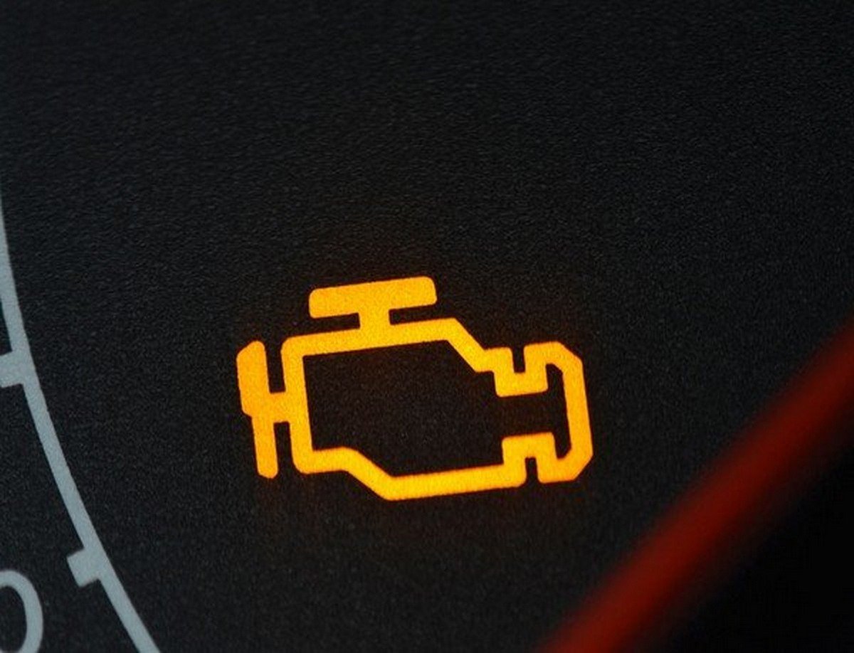 Yellow engine warning light on dashboard