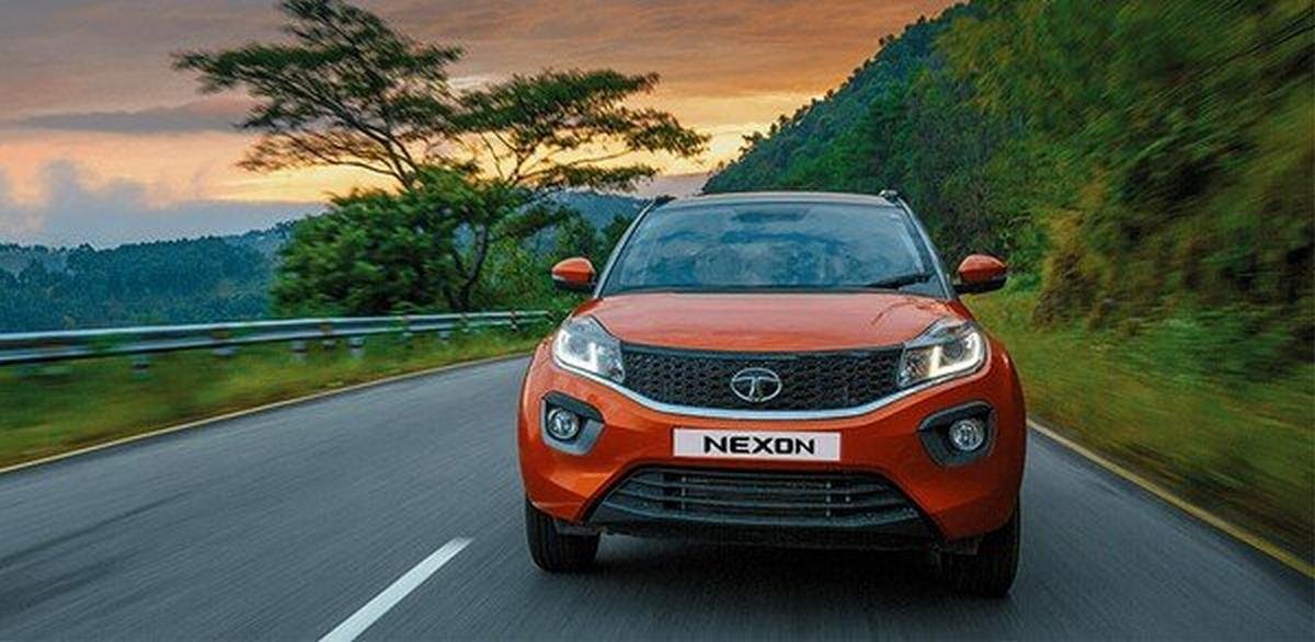 5 seater cars in india tata nexon orange front angle