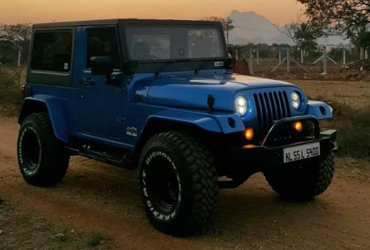Modified Jeep Thar blue colour front three quarters right side