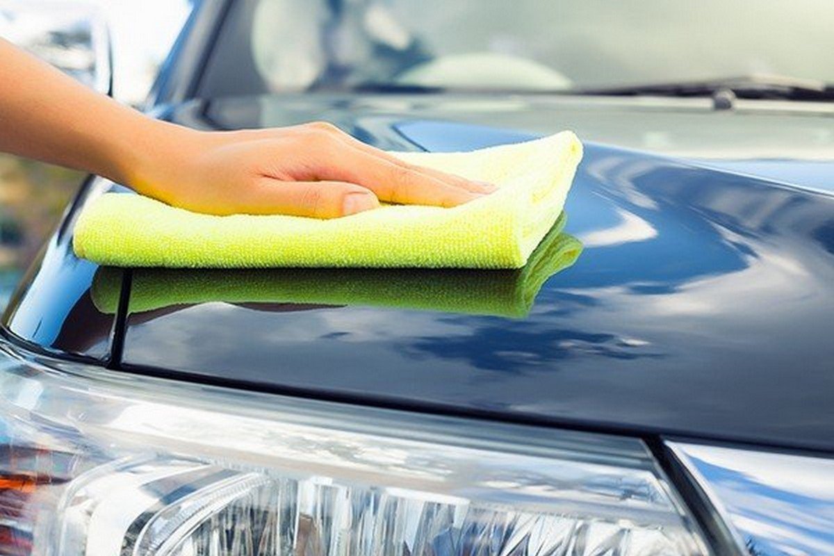 using lint-free cloth to clean car