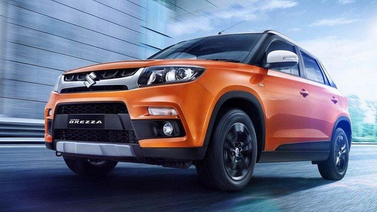 facelifted maruti vitara brezza orange front angle