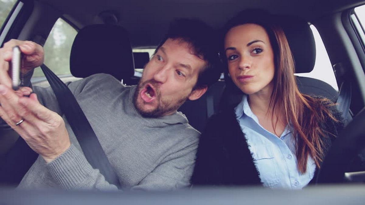 10 Most Annoying Car Passenger Habits On The Drive - taking selfies of driver