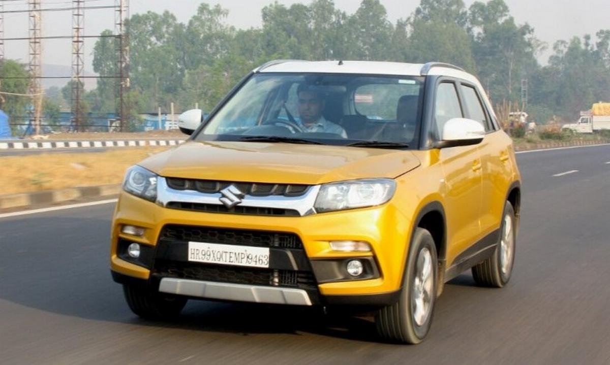 maruti vitara brezza yellow front angle