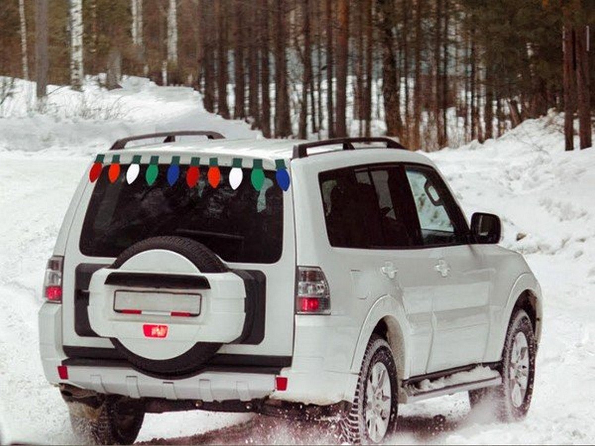 SUV parking on snow with colorful paper light 