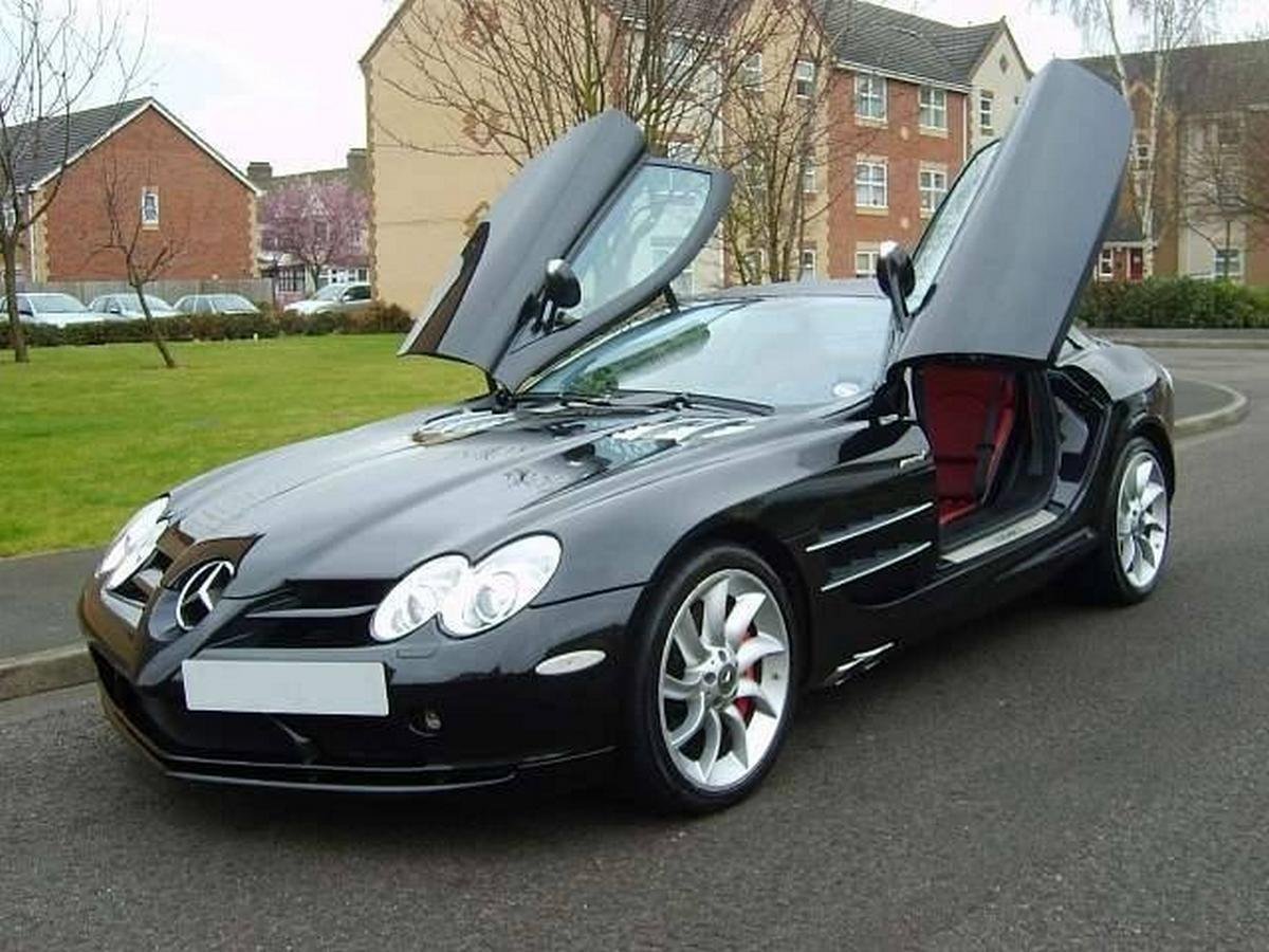 a black  Mercedes- Benz SLR McLaren with open doors