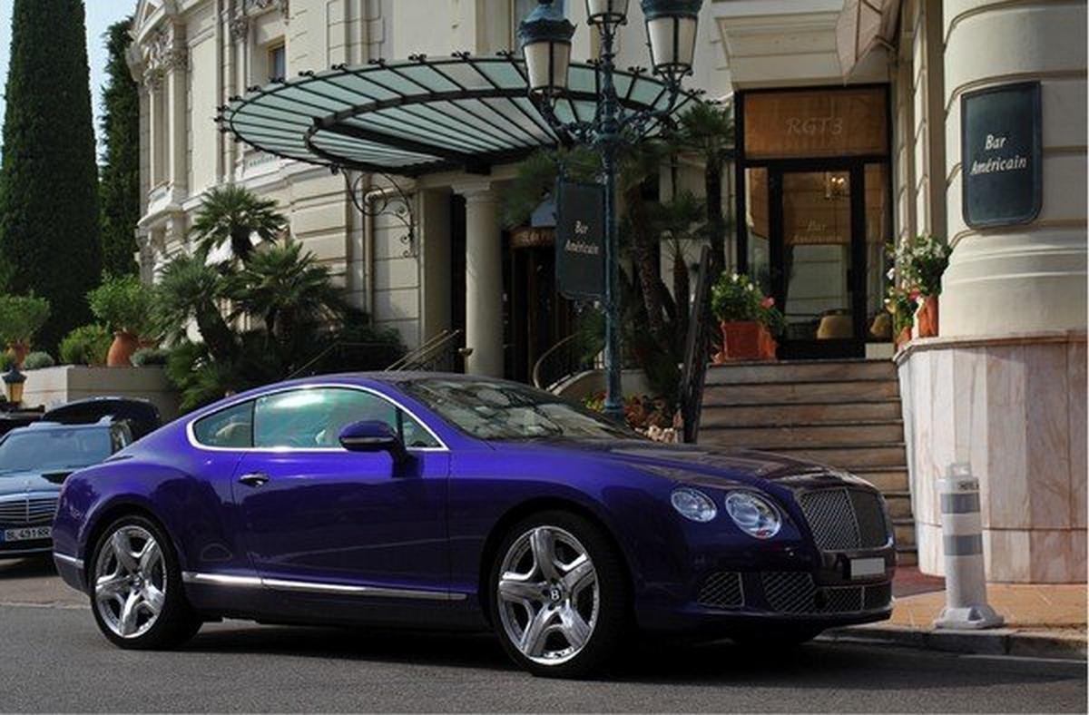 lilac bentley Brooklands in front of a hotel