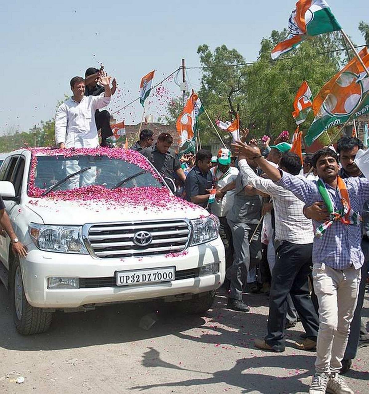 indian politician and his toyota in a parade