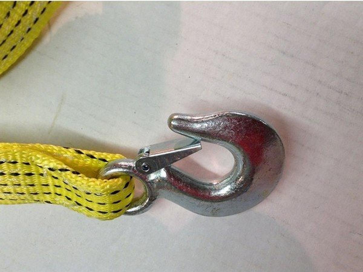 A yellow strap with hooks on