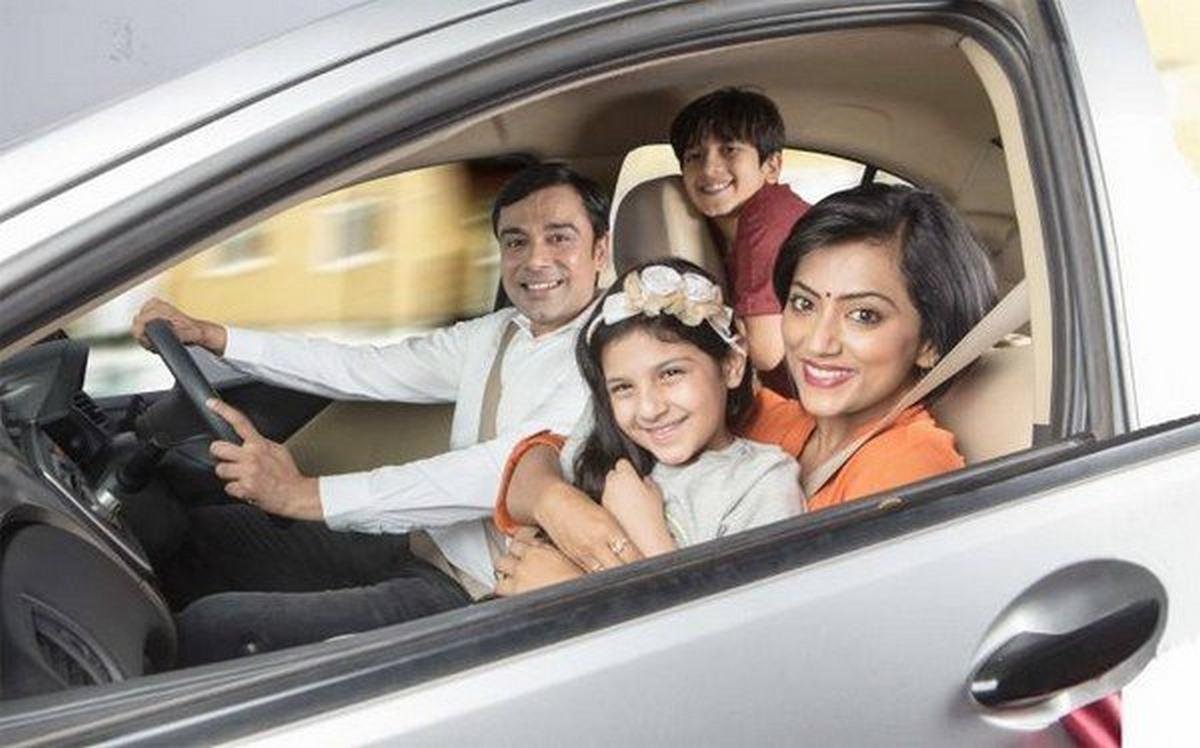 Indian family inside a car