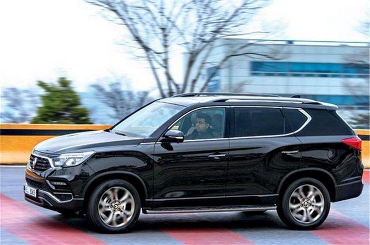 Ssangyong Rexton SUV black color running on road