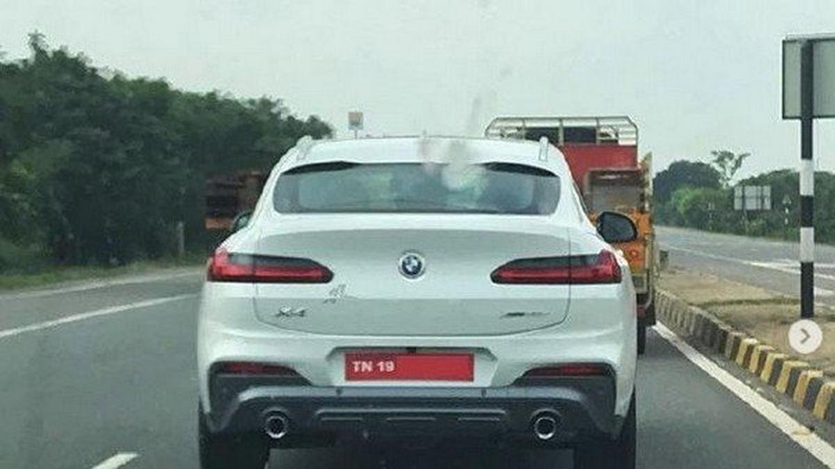 BMW X4, white colour, rear angular look