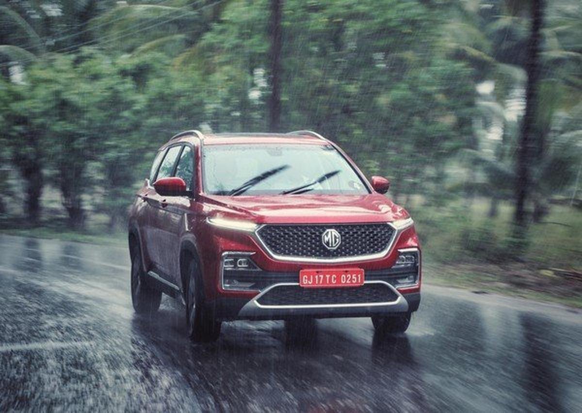 mg hector suv action shot red colour front angle