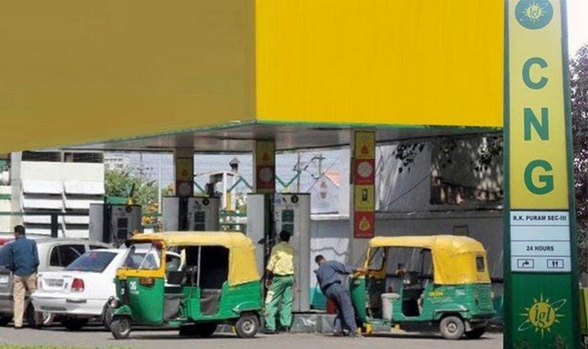 a green and yellow CNG station