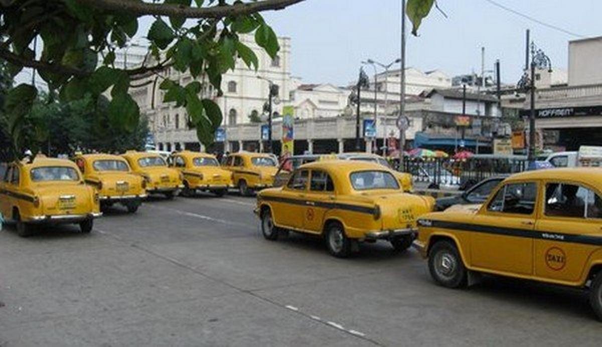 taxi uber yellow rear angle