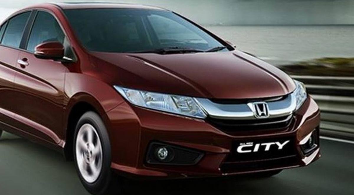 Red Honda City front-side view