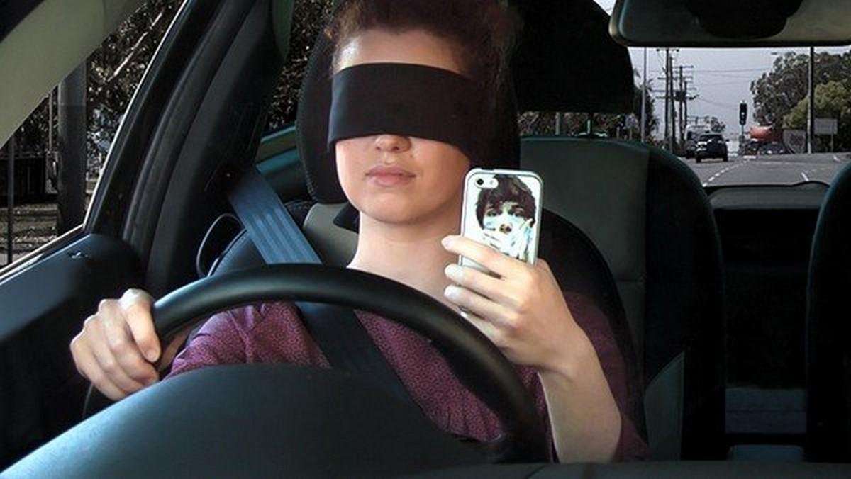 driving car with closed eyes phone using while driving