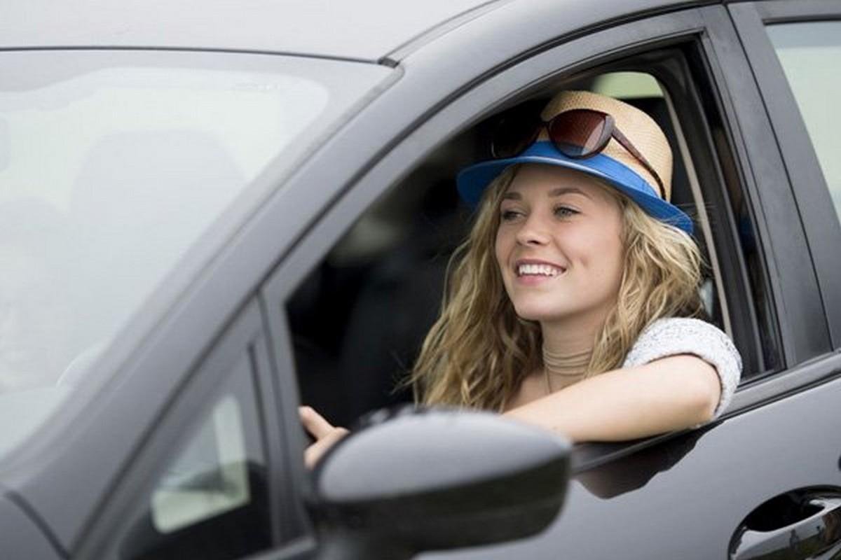 a girl next to an open car window