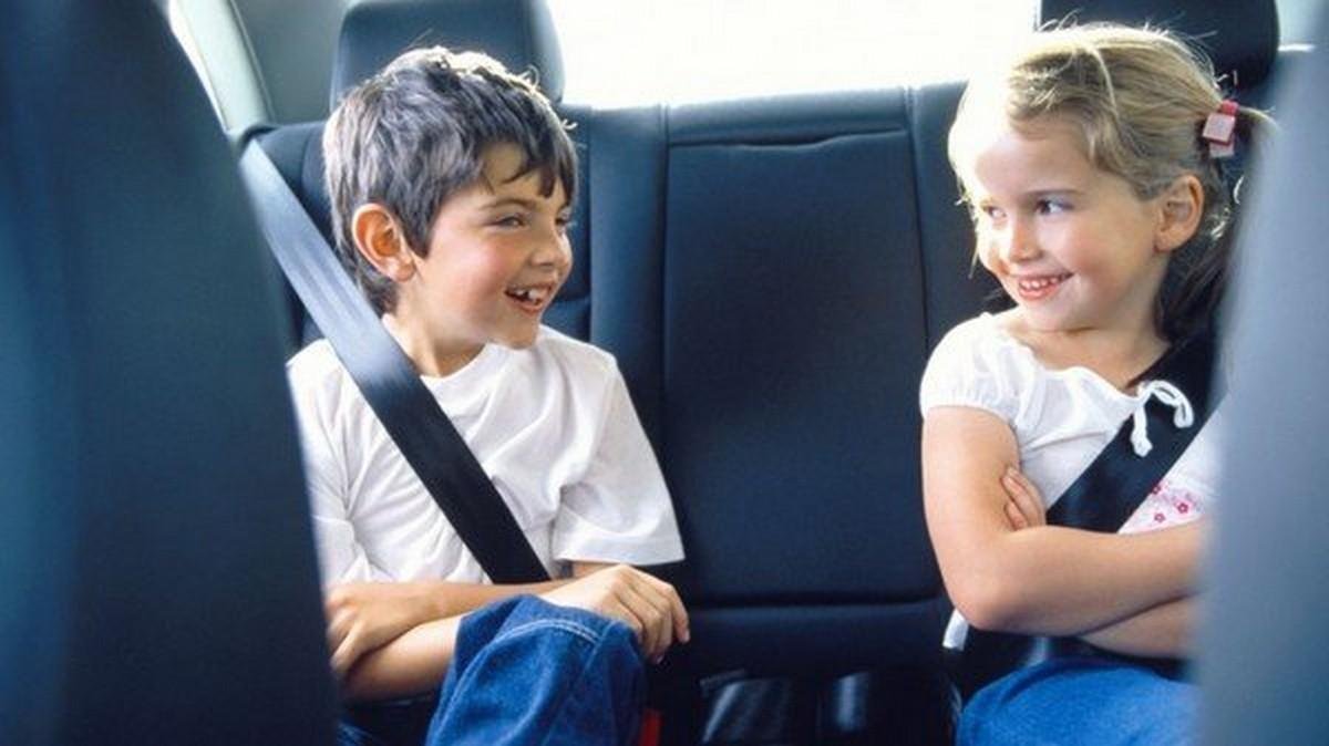 two kids wearing seatbelt