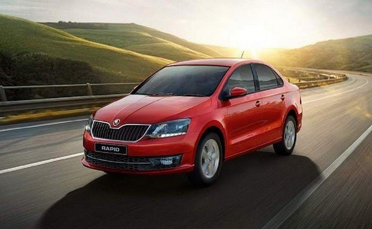 Skoda Rapid red color on road front and side look 