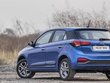 Hyundai Elite i20 blue colour  park on the road rear look