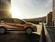 Renault Captur 2017 exterior side view dual tone black and orange colour