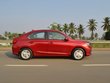 2018 Honda Amaze red side profile in action