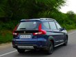 2019 Maruti XL6 blue rear angle in action