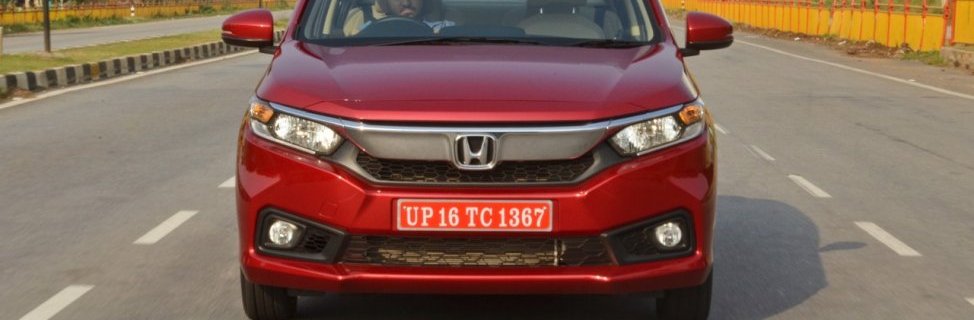 2018 Honda Amaze red front in action