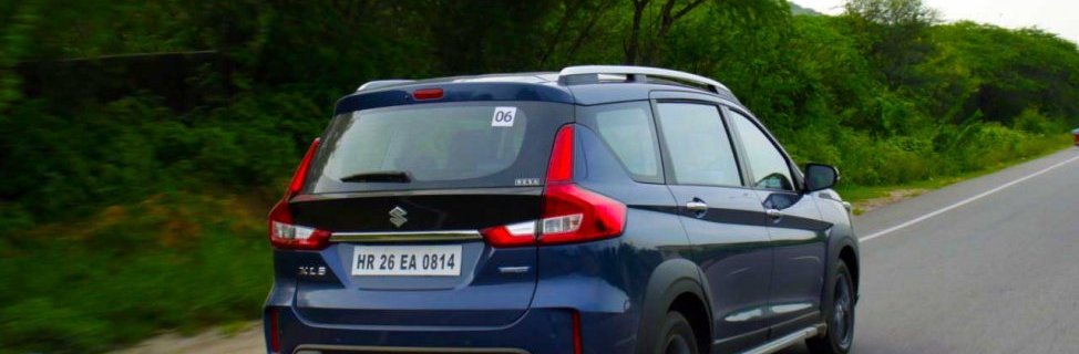 2019 Maruti XL6 blue rear angle in action