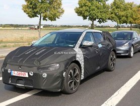 Kia’s Upcoming Electric SUV Spotted Testing Alongside Tesla Model 3