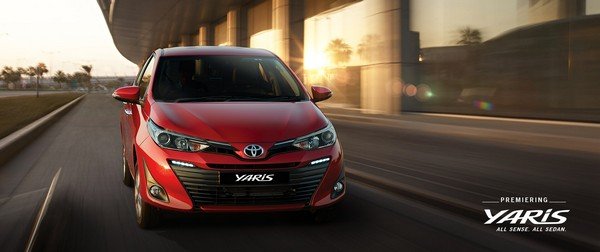 Toyota Yaris red color front look on road